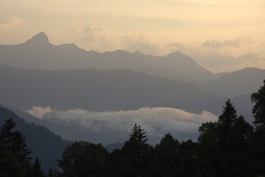 
morning in the mountains, in the alps, switzerland. view of mountain peaks, clouds, forests, bavaria