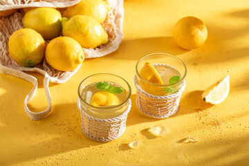 Fototapeta premium Tasty lemonade with crushed ice and sour fruit.
