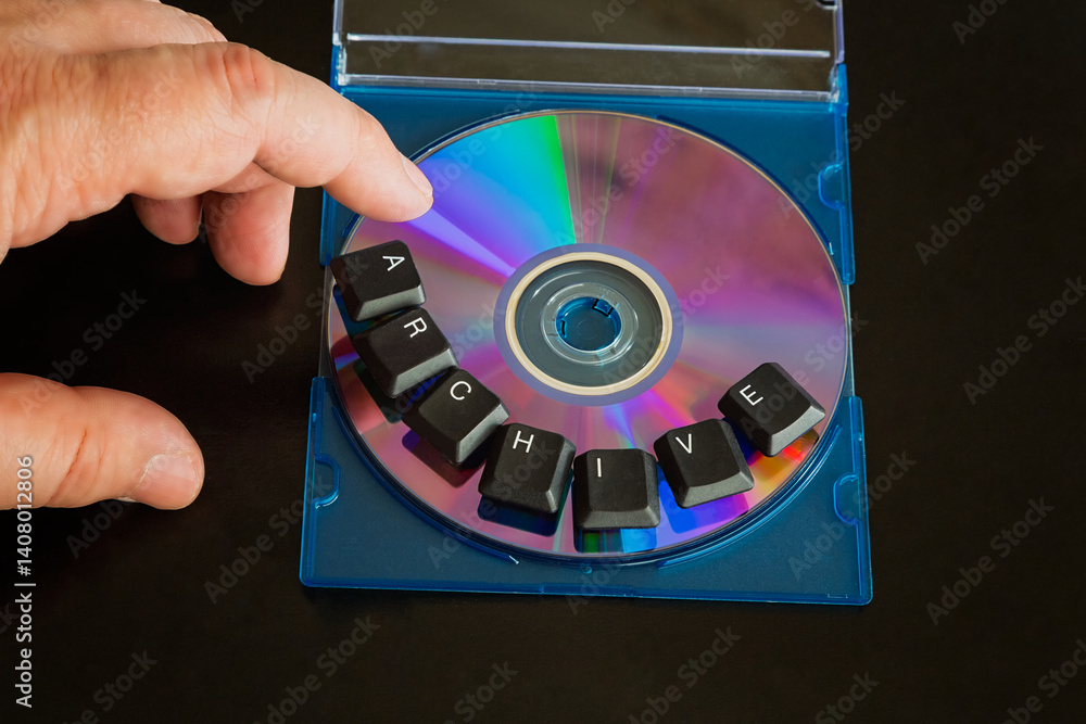 Aufkleber a finger hovering over a computer compact disc labeled 