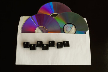 Old computer disks in a white envelope with the word 
