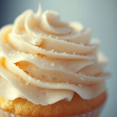 A macro shot of the delicate icing on a cupcake or layers of a pastry.