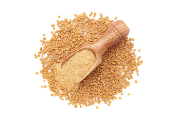 A wooden scoop filled with organic Fenugreek seeds (Trigonella foenum-graecum) powder, placed on a heap of fenugreek seeds, isolated on a white background.