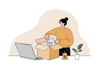 A woman unpacks a cardboard box while looking at a laptop. Casual attire, modern interior, and a recycling bin suggest eco-conscious lifestyle and online shopping.