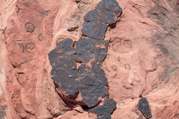Desert varnish or rock varnish. Aztec Sandstone(Jurassic) geological formation. weathering. Scenic Loop Dr, Red Rock Canyon National Conservation Area, Las Vegas, Clark County, Nevada. Mojave Desert. 