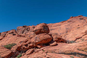 Desert varnish or rock varnish. Aztec Sandstone(Jurassic) geological formation. weathering. Scenic...