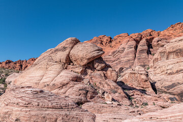 Fototapeta premium Aztec Sandstone(Jurassic) geological formation. weathering. Scenic Loop Dr, Red Rock Canyon National Conservation Area, Las Vegas, Clark County, Nevada. Mojave Desert. 
