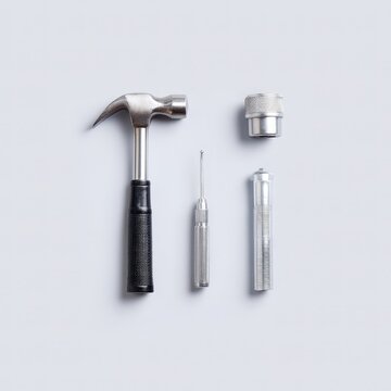 Diagnostic tools flat lay, including reflex hammer, otoscope, and tongue depressor