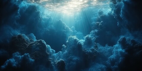 Dramatic underwater scene with sunlight filtering through clouds beneath the ocean surface