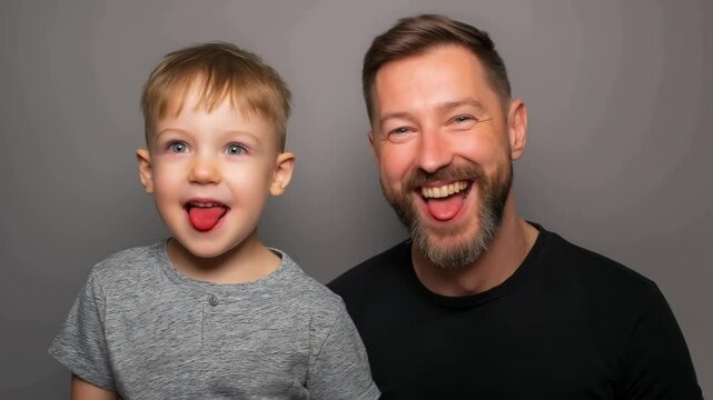 Happy father's day! Father and son making faces when taking selfie. Funny dad and son fooling around