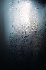 Obraz premium Condensation on a surface creating an abstract, textured pattern