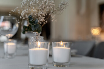 beautiful table decoration in restaurant. festive table setting in restaurant. white tablecloth on...