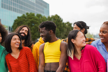 Crowd of diverse friends having fun together in the city - Multiracial young people outdoor - Community and social inclusion concept