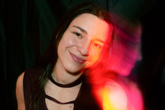 Portrait of a smiling woman with creative light effect