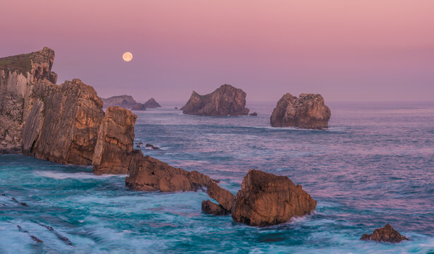 Full Moon Over Coastal Cliffs at Arnia Beach, Cantabria Sunrise