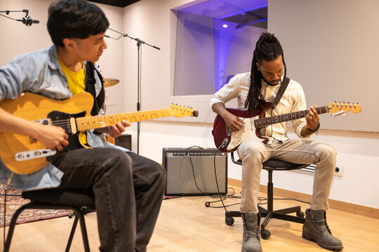 Musicians Collaborating in a Modern Recording Studio