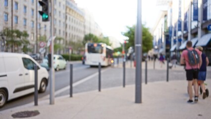 Fototapeta premium Busy street in marseille, france with blurred pedestrians, vehicles, and buildings creating an artistic bokeh effect in an urban daytime setting.