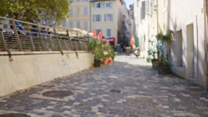 Blurred street scene in marseille features defocused scenery and bokeh effect, capturing the charm of an outdoor european setting in france with soft focus.