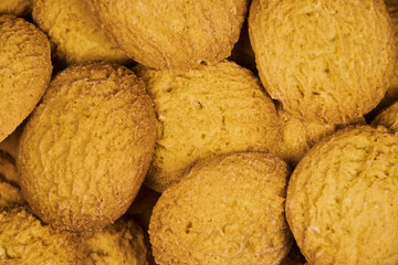 A group of sugar cookies are stacked haphazardly, one on top of the other, with no colored background..Close Up