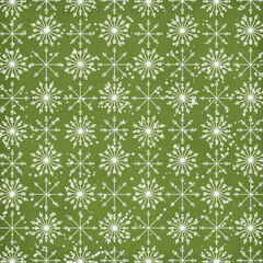 Seamless green Christmas pattern with white snowflakes and falling snow, festive winter background ideal for wrapping paper, fabric, gift packaging, scrapbooking and holiday decor.