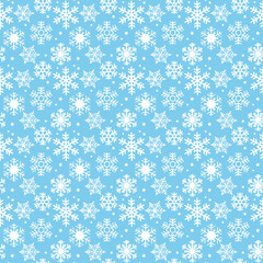 Seamless light blue winter pattern with white snowflakes and falling snow. Cute Christmas background for wrapping paper, fabric, kids decor, greeting cards and holiday designs.