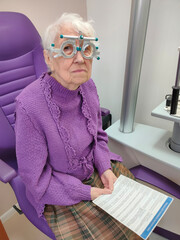 Optometry, slit lamp and eye exam by senior woman or patient with medical insurance using machine. Ophthalmology, eyesight and female test vision in clinic as eyecare during consultation