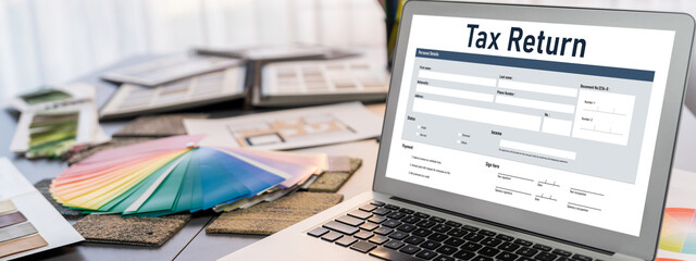 Interior designer workspace table and architecture software on laptop screen with mood board materials and colorful swatch color for color selection. Modern interior design office. Insight
