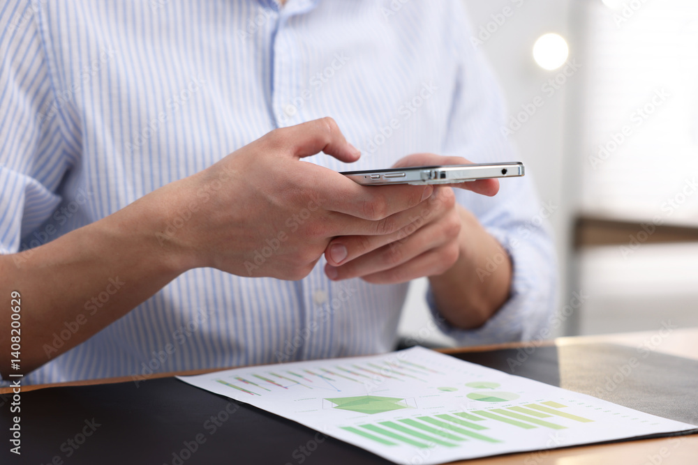 Poster man taking photo of document using scanning app on smartphone at desk in office, closeup