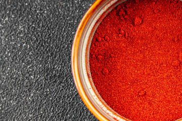 Red pepper cayenne ground pepper paprika spice appetizer vegetables dish organic product fresh tasty gourmet food background on the table rustic food top view copy space