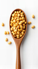 Wooden spoon with dry grains on white background