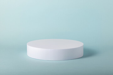 White round stand on blue background. Minimal mock up  for your products.