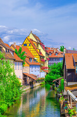 Colmar cityscape, Little Venice la Petite Venise area with old medieval houses on bank of river...