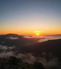Naklejka premium Golden sunrise hues paint the Brecon Beacons, mist clinging to valleys below, breathtaking view, hills, nature