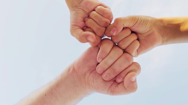 held hands circle, forming bond. woman man hands joined together, symbolizing unity. fingers interlocked tightly, showing strength. people gripped each other's hands, supporting each other. hand came