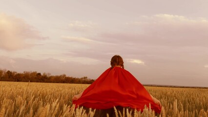 little girl child kid runs through wheat field red cape, happy family, child plays wheat field...