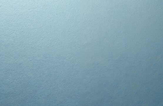 Pale blue genuine leather background. Textured surface, detailed grain, slight wrinkles. Ideal for product demos, design templates. High quality. Soft smooth surface. Empty copy space for text.