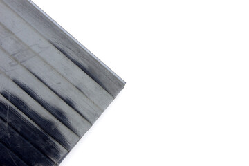 Black tranparent polycarbonate plastic sheets panels for translucent roofing on white background.