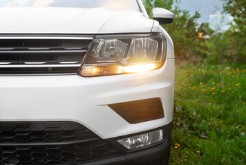 Modern car white headlight close up