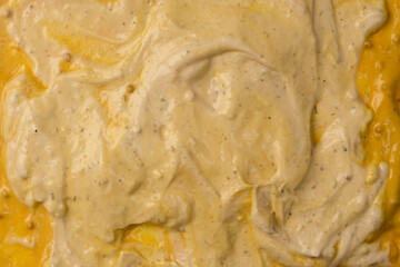 Yellow sauce splashes as a background.