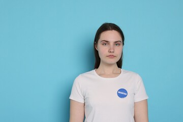 Portrait of volunteer on light blue background. Space for text