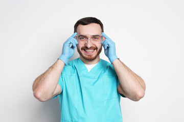 Fototapeta premium Portrait of professional dentist on light background