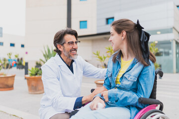 Obraz premium Doctor greets young woman with cerebral palsy outside medical center - They share a positive and warm interaction during checkup - Concept of cerebral palsy
