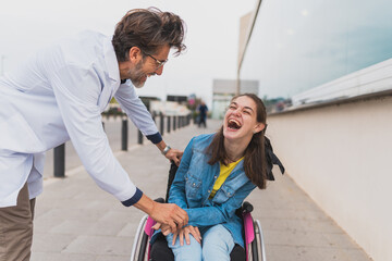 Doctor shares joyful moment with young woman with cerebral palsy - They laugh together after...