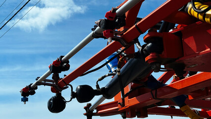 Spraying system close-up on a modern agricultural sprayer, with visible fertilizer nozzles and piping.