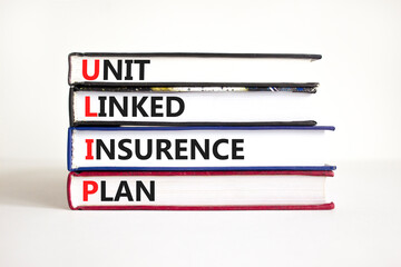 ULIP Unit Linked Insurance Plan symbol. Concept word ULIP Unit Linked Insurance Plan on beautiful books. Beautiful white background. Business ULIP Unit Linked Insurance Plan concept. Copy space.