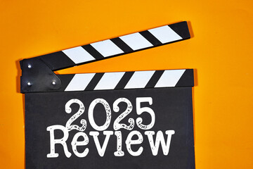 Review 2025 concept on clapper board of video cinema in studio. Movie production clapper board