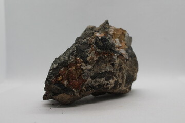 Pyrite in a rock isolated on a white background. natural silver pyrite gem on white background. Pyrrhotite or Pyrite from Baska, Frydek Mistek, Czech republic 