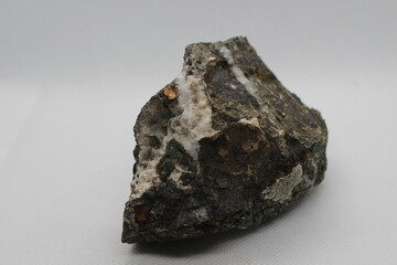 Pyrrhotite mineral isolated on a white background. Pyrite mineral isolated on a white background. Pyrrhotite or Pyrite from Baska, Frydek Mistek, Czech republic 