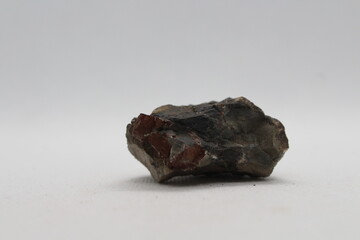Pyrrhotite mineral isolated on a white background. Pyrite mineral isolated on a white background....