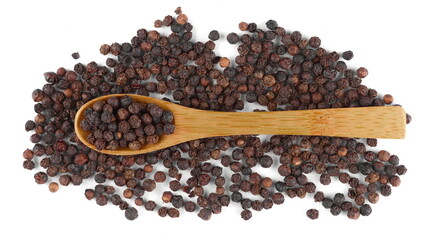 Black pepper in wooden spoon isolated on white background