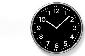 A black and white wall clock shows silent time. Space for text.